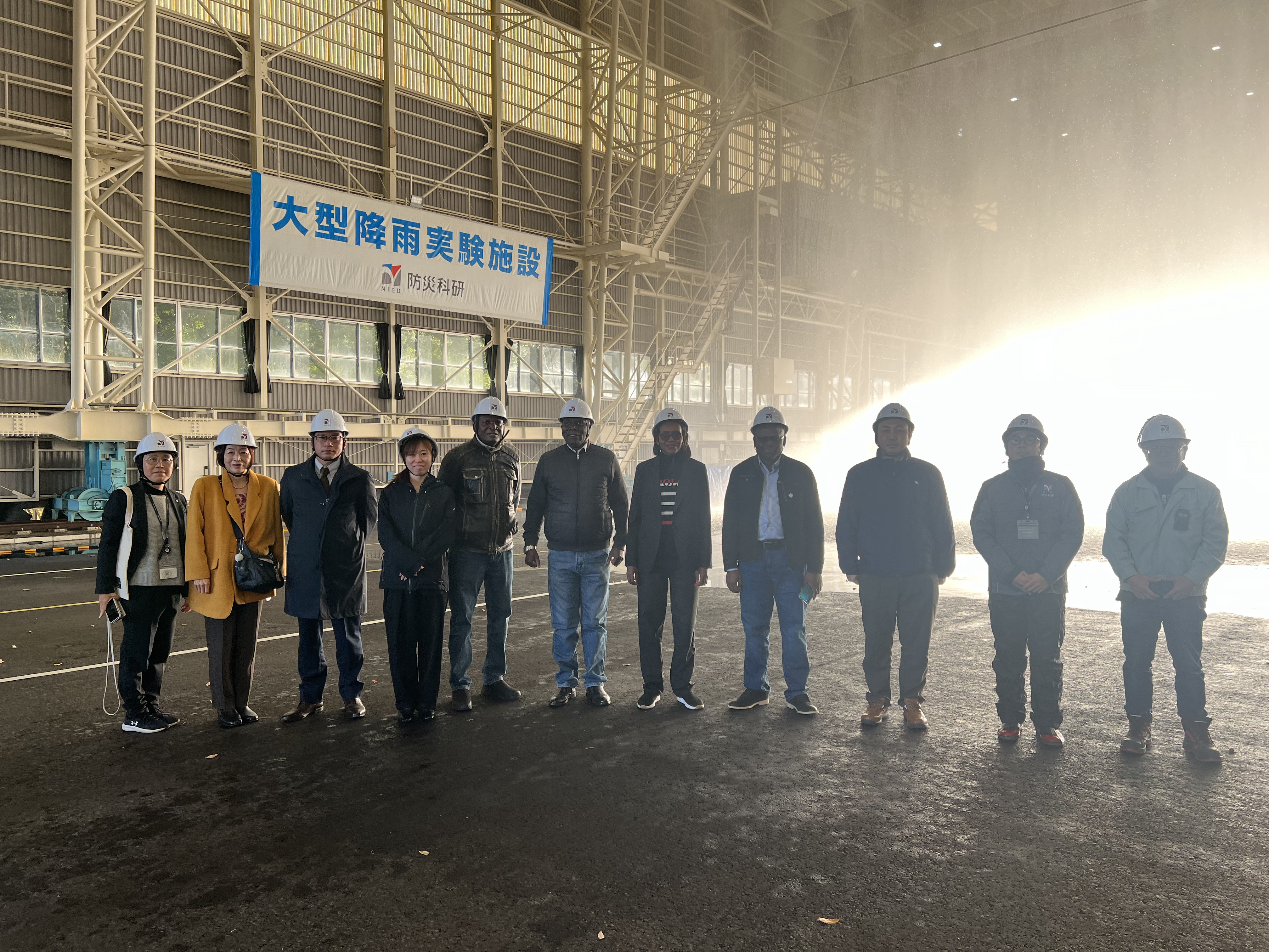 Visit to Large-scale Rainfall Simulator 
Dr. ISHIZAWA explaining about the experiments.
