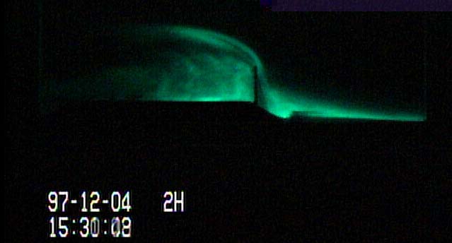 Visualized drifting snow around the model snow fence with a laser light sheet.